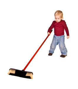 Little boy with a broom