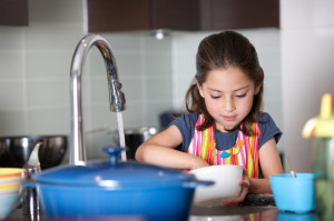 girl doing chores iStock