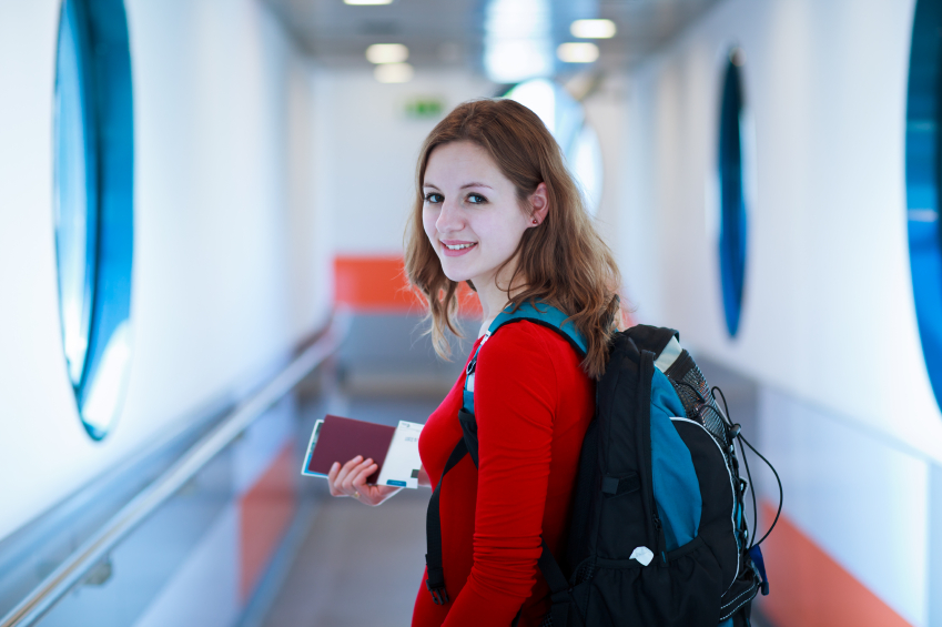 Portrait of a young woman in the boarding bridge, boarding an ai