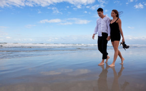 Romantic Man and Woman Couple Walking On A Beach