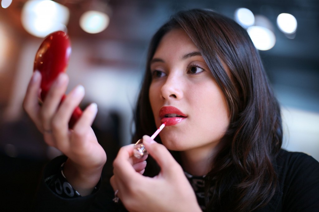 putting on makeup