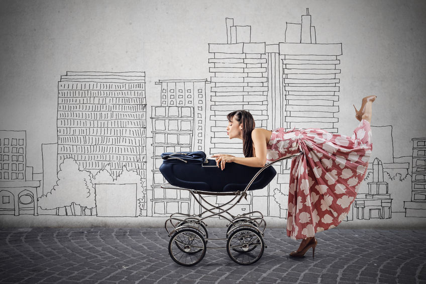 doting au pair bending over baby carriage against illustrated city background
