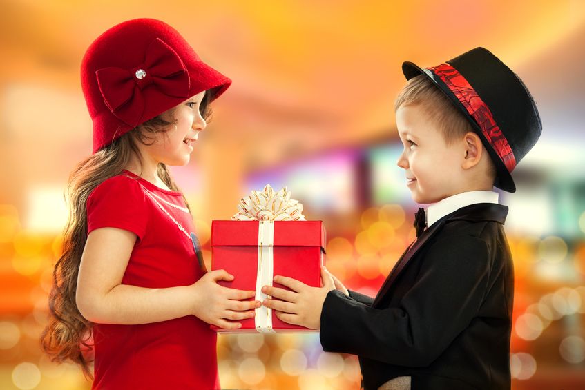 two children exchanging gifts