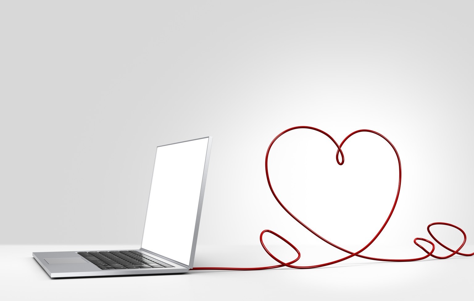 Laptop computer with cable forming a heart