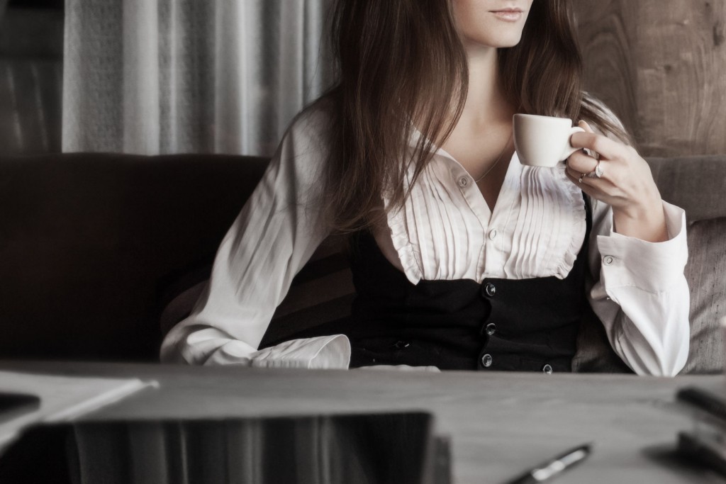 Fashion art portrait of young pretty business woman in restaurant